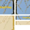thanksgiving Delicate branches with yellow flowers against a blue sky, featuring the word "Thanksgiving" in bold yellow.