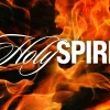 6585 - Holy Spirit - HD Title Slide The words "Holy Spirit" in white text overlaid on a background of swirling orange and yellow flames