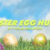 6882 - Easter Egg Hunt - HD Title Slide Church media template showing colorful Easter eggs in green grass with bright blue sky and yellow text promoting Easter egg hunt event