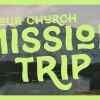 7590 - Mission Trip HD Title Slide "Vibrant graphic promoting a church mission trip, featuring mountains, a lake, and trees, symbolizing community and service."