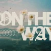 7927 on the way hd title slide Floral imagery floats on serene waters, symbolizing faith and community, with the phrase "On the Way" prominently displayed.