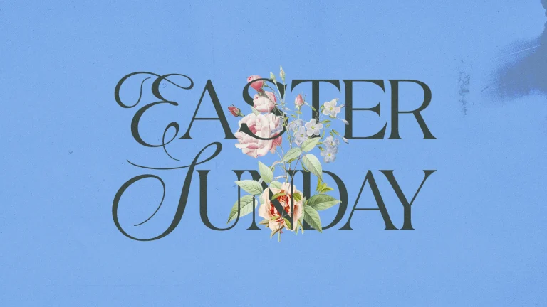 Easter Sunday text adorned with flowers on a soft blue background, symbolizing renewal and celebration of faith.