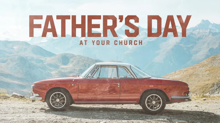 Classic red car parked against a scenic mountain backdrop, promoting Father's Day celebration at the church.