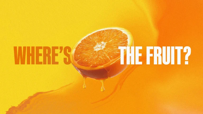 Bright orange background with a halved orange dripping juice, emphasizing the question "Where's the fruit?" in bold text.