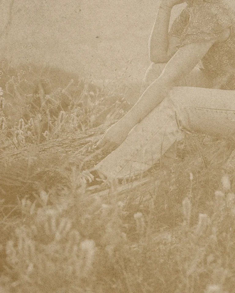 A person in a serene field, reflecting on faith and community, embodying spiritual connection and contemplation.