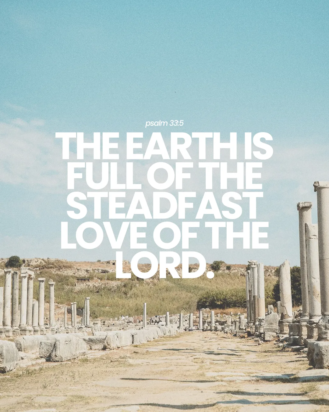 Ancient ruins under a blue sky, featuring the text of Psalm 33:5 about God's steadfast love.