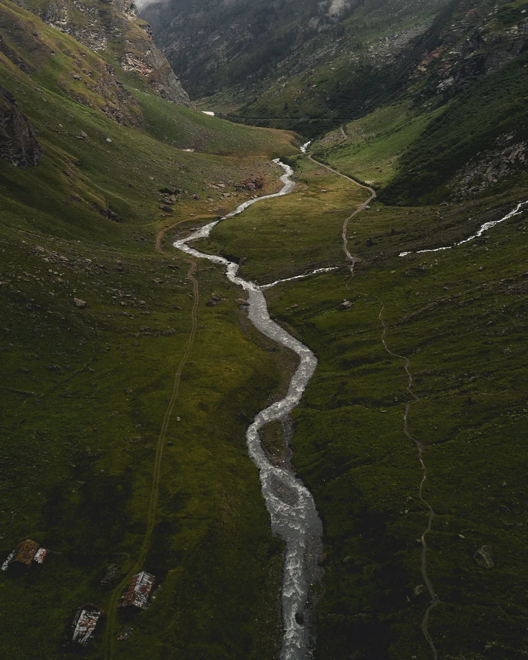 Winding river flows through lush valleys, symbolizing God's guidance and the beauty of creation in nature.