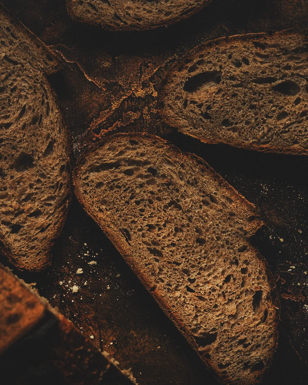 Freshly baked bread slices arranged together, symbolizing communion, nourishment, and the sharing of faith in community.