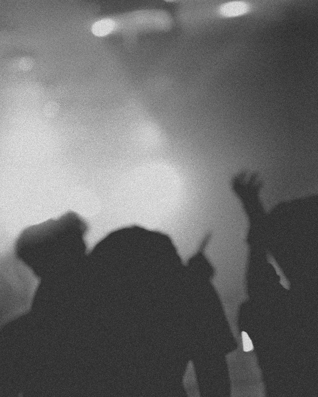 Silhouettes of worshippers raising hands in praise, immersed in a spiritual atmosphere filled with light and community.