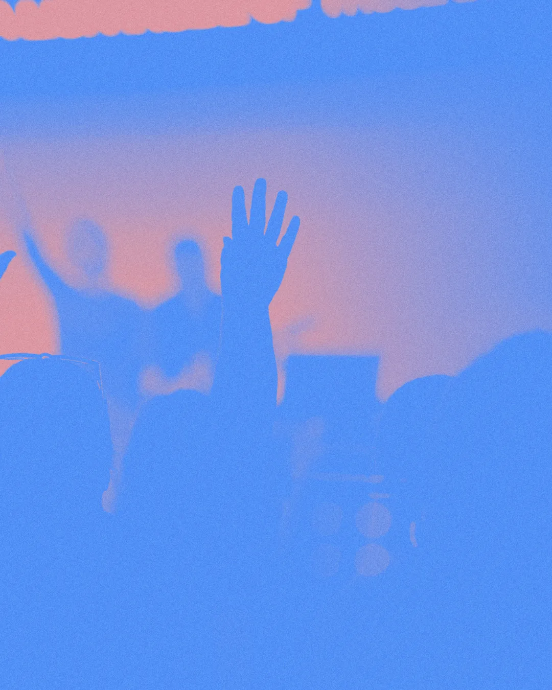 Hands raised in worship during a vibrant church service, embodying community, faith, and spiritual connection.