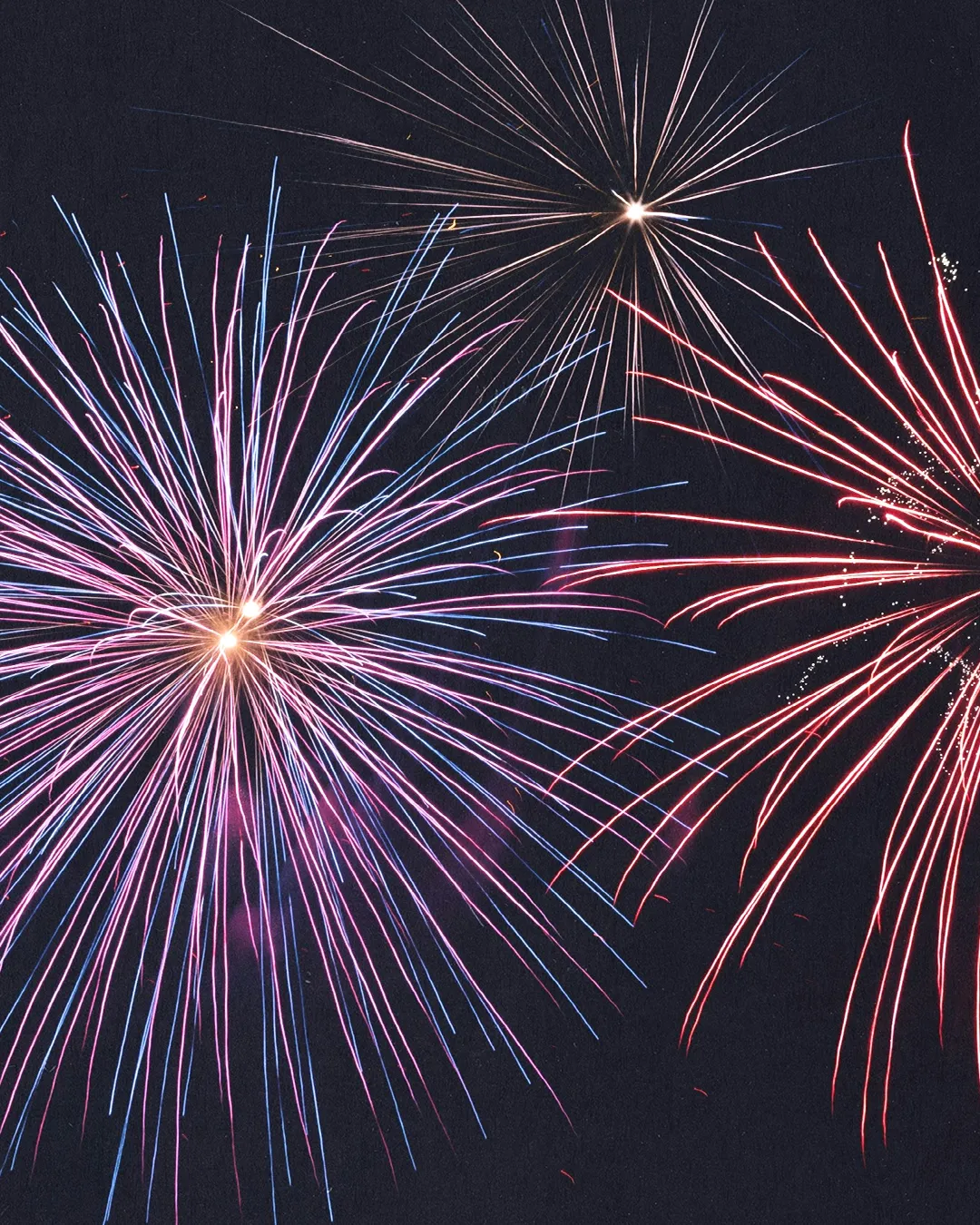 Colorful fireworks burst in the night sky, symbolizing joy, celebration, and community spirit in faith gatherings.