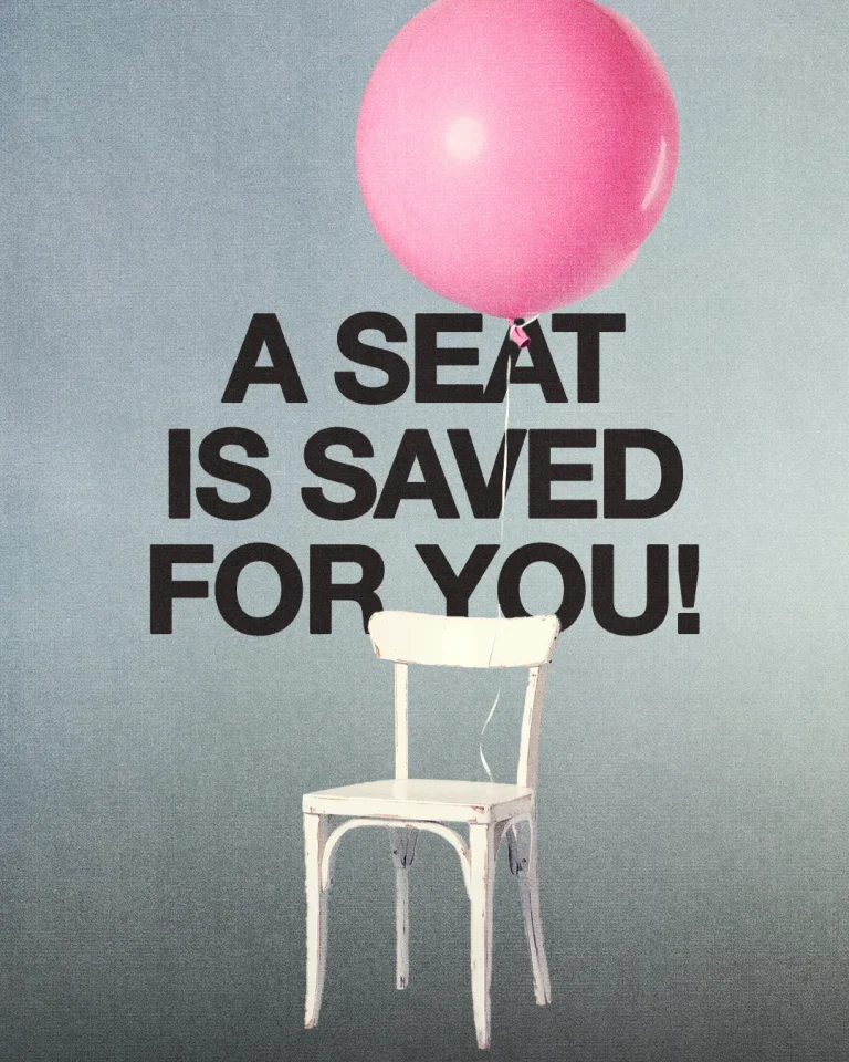 A white chair with a pink balloon above, inviting community and emphasizing that everyone is welcome.