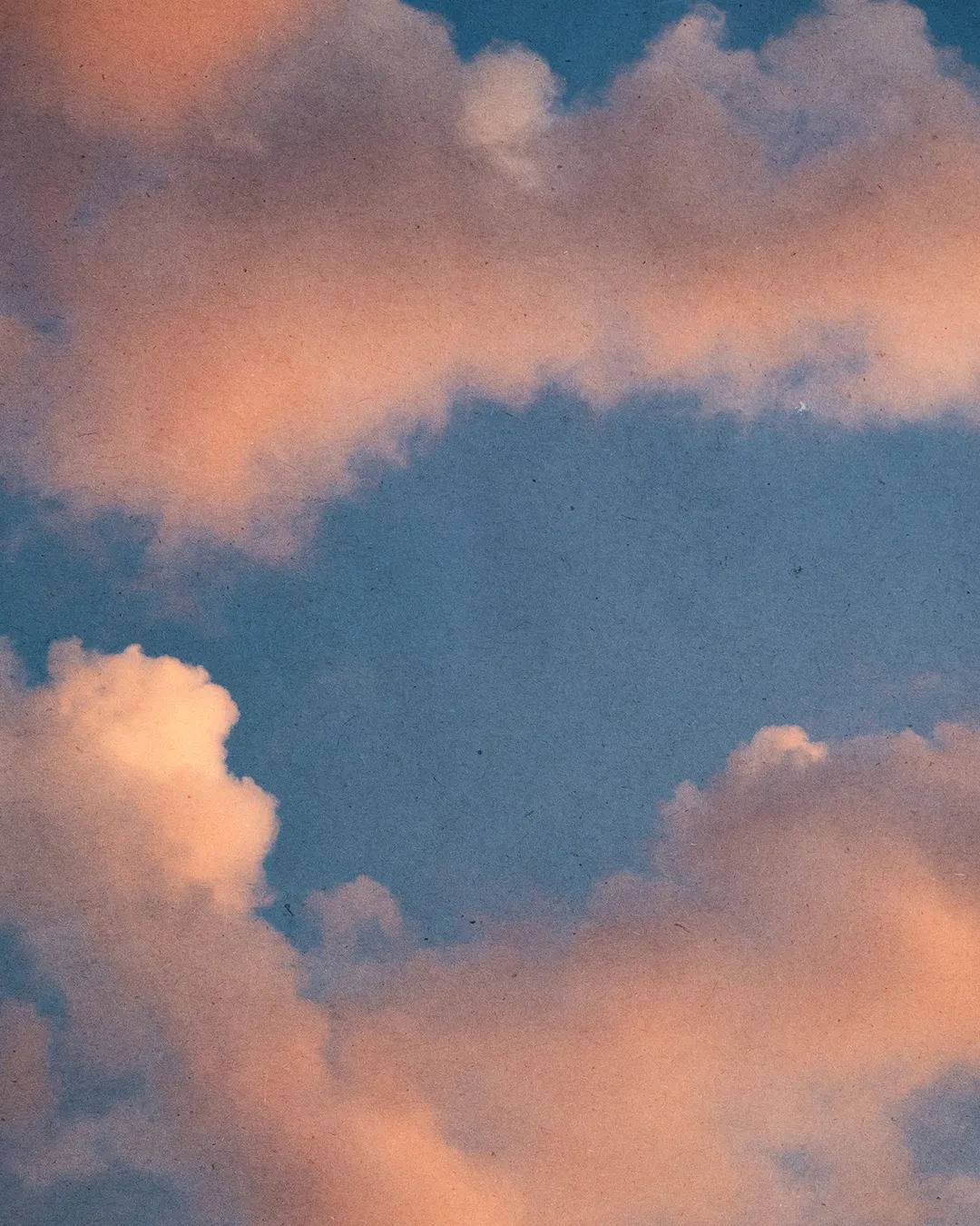 Soft pink and blue clouds evoke a sense of peace and divine presence, reflecting hope and faith in the heavens.