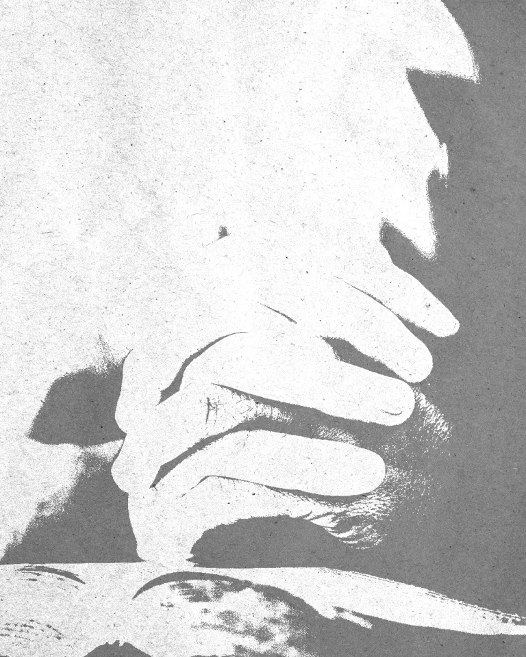Hands clasped in prayer over an open Bible, symbolizing faith, devotion, and spiritual connection.