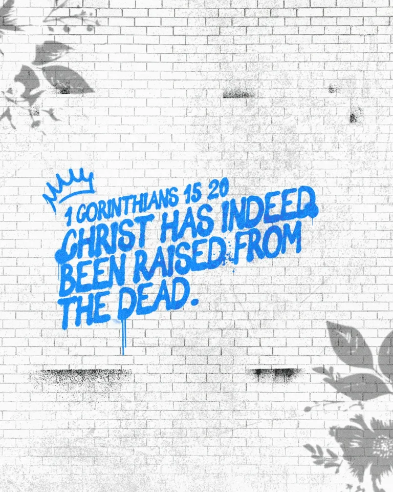 "Bold scripture from 1 Corinthians 15:20 celebrates Christ's resurrection, surrounded by floral designs on a textured wall."