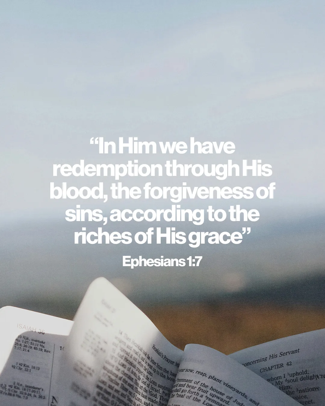 “Redemption and forgiveness through Christ’s grace,” Ephesians 1:7, with an open Bible against a serene background.