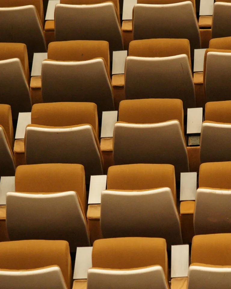 Rows of empty church seats, inviting community gathering for worship and fellowship.
