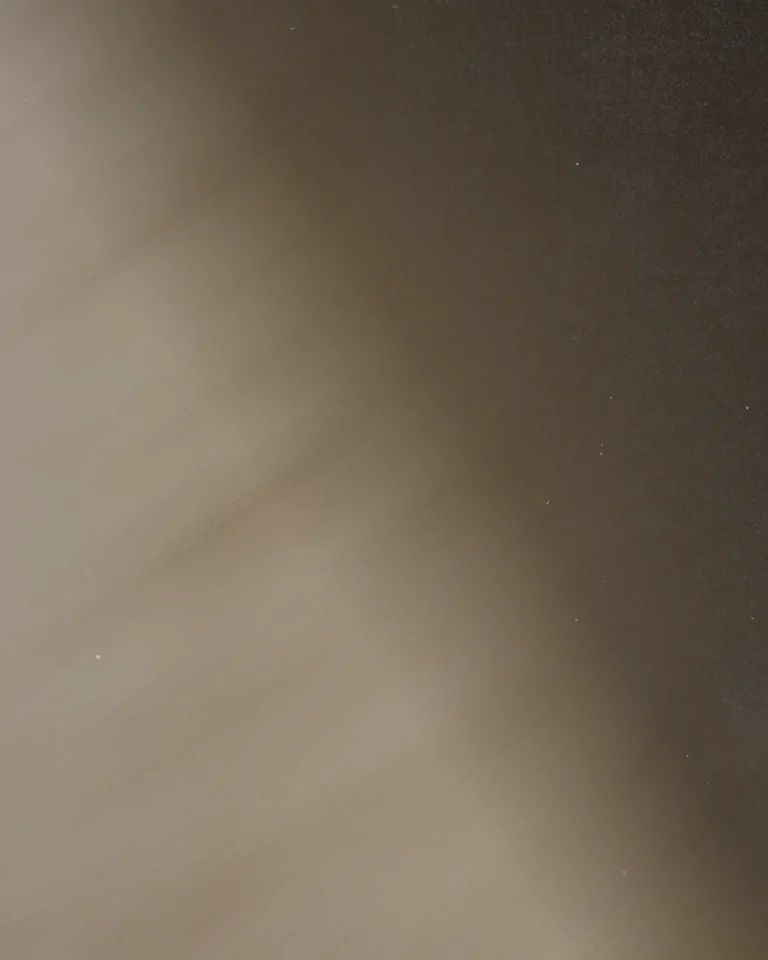Soft gradients of brown and black evoke a sense of calm, reflecting spiritual depth and community unity.