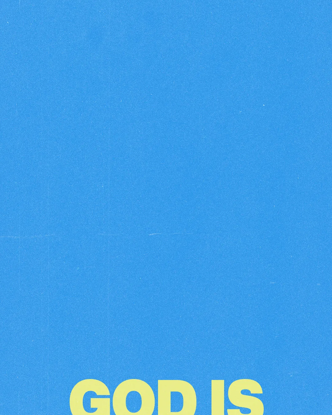 Bright blue background with bold yellow text proclaiming "GOD IS," inviting reflection on faith and divine presence.