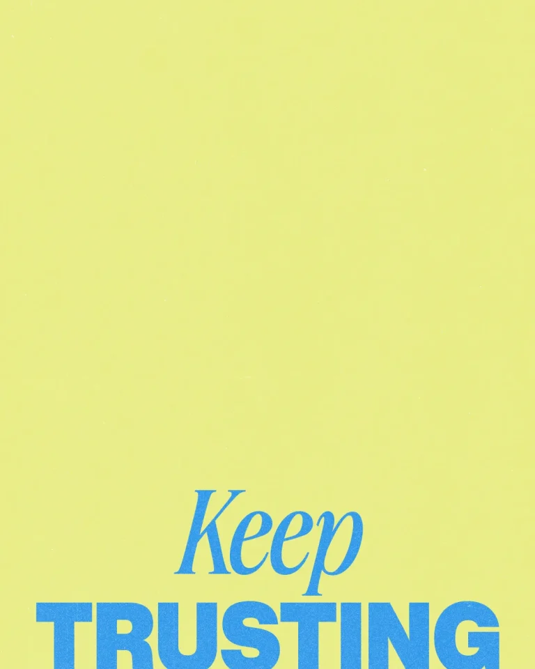 Bright yellow background with bold blue text: "Keep TRUSTING," encouraging faith and perseverance in the community.