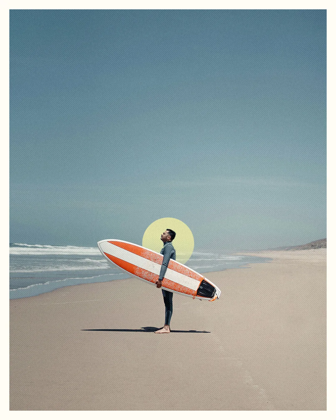 A surfer stands on the beach, gazing at the horizon, embodying faith, adventure, and connection with creation.
