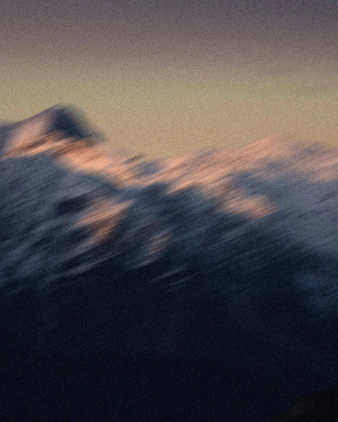 Majestic mountains at dusk, symbolizing God's creation and the beauty of faith in nature.